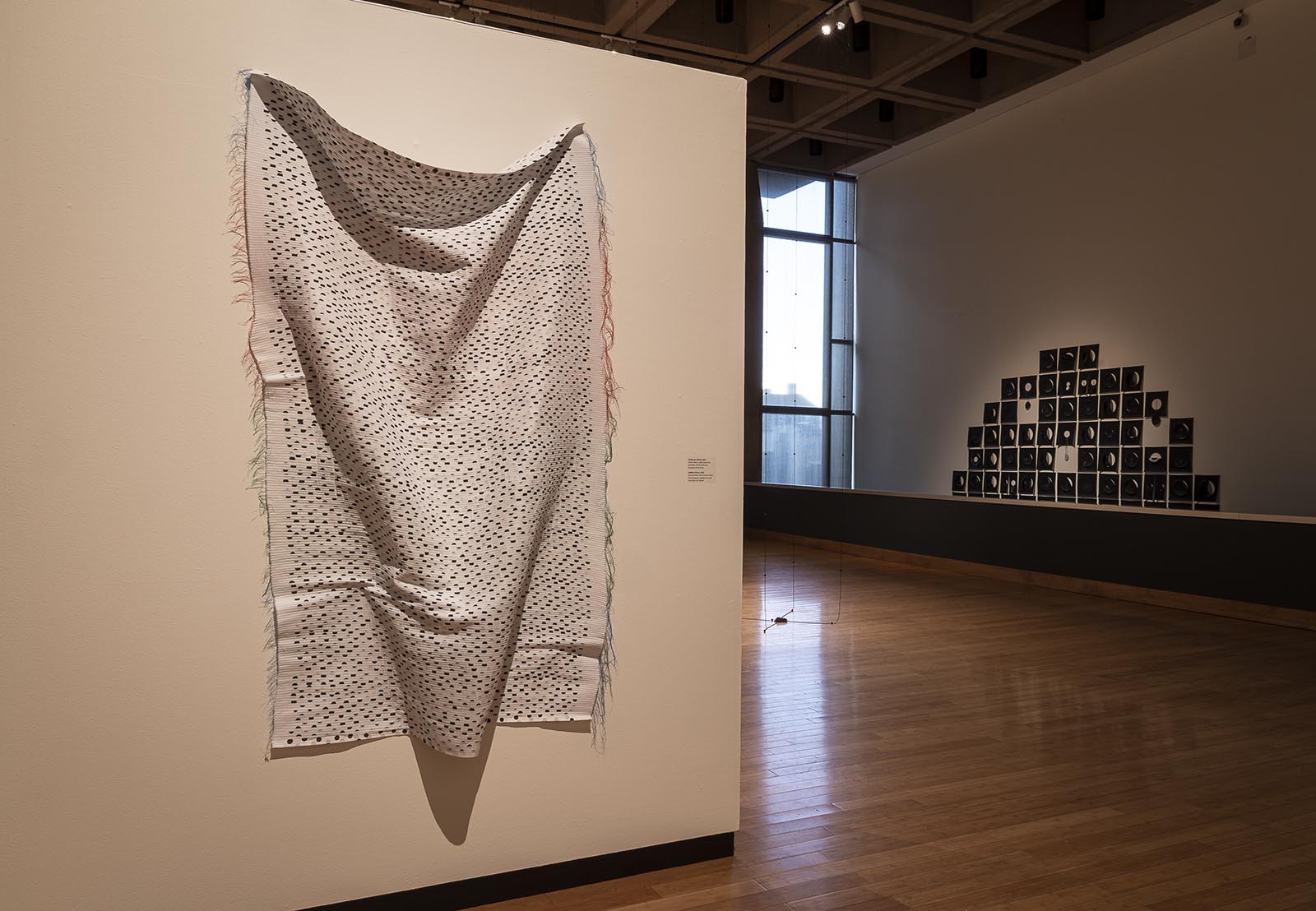 Installation view of "Deliberate (Cloth)" with "Within/Without" and "Squaring Circles" in the background.